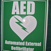 Load image into Gallery viewer, AED Automated External Defibrillator sticker on a green background