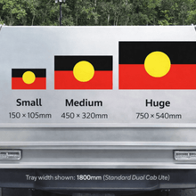 Load image into Gallery viewer, Truck bed with size indicators for different aboriginal flag designs on a road.