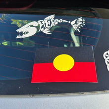 Load image into Gallery viewer, Car window with three stickers: an Aboriginal flag, a white geometric design, and a black and white animal emblem.