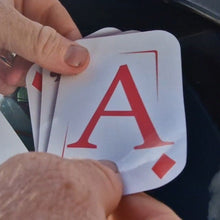 Load image into Gallery viewer, Hand holding a card with the letter 'A' on it