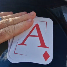 Load image into Gallery viewer, Hand holding aces with a blurred background