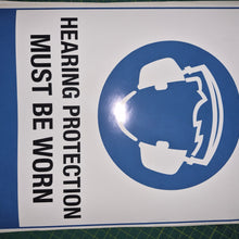 Load image into Gallery viewer, Sign with a helmet icon and text 'Hearing protection must be worn' on a white background with blue border.