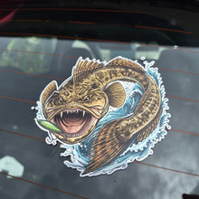Load image into Gallery viewer, A die-cut vinyl sticker of a detailed flat head fishing lure graphic, shown applied to the rear window of a car.