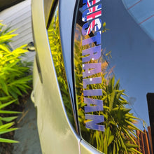 Load image into Gallery viewer, Car window with 'AUSTRALIAN' decal featuring Australia flag, reflecting greenery.
