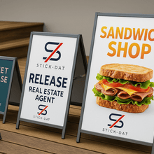 Load image into Gallery viewer, Set of sandwich shop signs with branding and promotional text on a wooden surface.