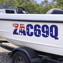 Load image into Gallery viewer, White boat with registration number C69Q on a trailer