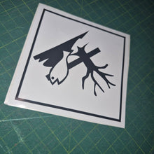 Load image into Gallery viewer, Black and white sticker with deer design on a green cutting mat