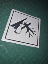 Load image into Gallery viewer, Black and white sticker with deer design on a green cutting mat