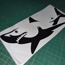 Load image into Gallery viewer, Black shark decal on a white sheet with a green cutting mat background