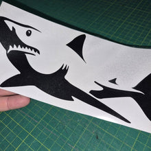 Load image into Gallery viewer, Black shark decal on a white card held over a green cutting mat