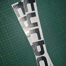 Load image into Gallery viewer, Turbo decal on a green cutting mat