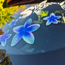 Load image into Gallery viewer, Frangipani Blue flower decals on a car window with blurred outdoor background