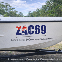 Load image into Gallery viewer, Boat with a decal showing the Australian flag and text 'ZAC69' against a natural background.