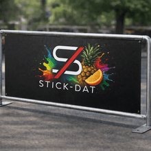 Load image into Gallery viewer, Outdoor setting with a 'Stick-Dat' branded banner featuring colorful graphics.