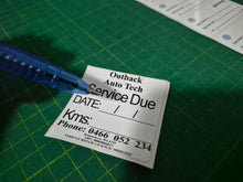 Load image into Gallery viewer, Double-sided service due decal showing reverse side with service date and contact information for mechanics