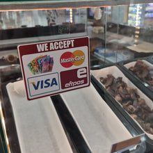 Load image into Gallery viewer, Glass counter with food displays and a sign accepting multiple payment methods.