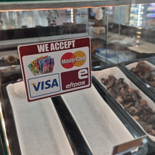 Load image into Gallery viewer, Glass counter with food displays and a sign accepting multiple payment methods.