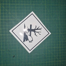 Load image into Gallery viewer, Sticker of a fish with a tree and log on a green cutting mat
