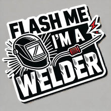 Load image into Gallery viewer, A vinyl sticker with the phrase 'FLASH ME, I'M A WELDER' in bold letters, accompanied by an illustration of a welding helmet with sparks and a welding torch.