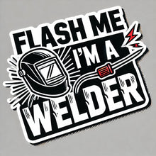 Load image into Gallery viewer, A vinyl sticker with the phrase 'FLASH ME, I'M A WELDER' in bold letters, accompanied by an illustration of a welding helmet with sparks and a welding torch.