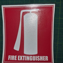 Load image into Gallery viewer, Fire extinguisher sign on a red background with white text and symbol, placed on a green cutting mat.