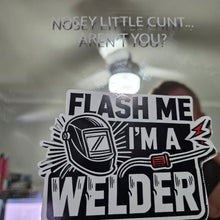 Load image into Gallery viewer, Sticker with text 'Flash me I'm a welder' held up to a mirror with offensive text.