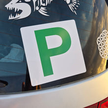 Load image into Gallery viewer, Car window with a green 'P' Provisional sticker and white fish skeleton decal.