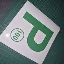 Load image into Gallery viewer, Green 'P' with number 100 on a white background on a green cutting mat.