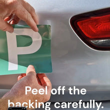 Load image into Gallery viewer, Person peeling a green and white 'P' plate from a car, with text instructing to peel off the backing carefully.