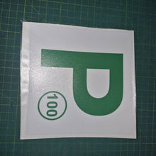 Load image into Gallery viewer, Green 'P' with number 100 on a white background on a green cutting mat.