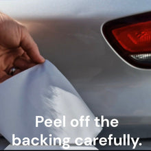 Load image into Gallery viewer, Green provisional stickers Person peeling off a car wrap with text 'Peel off the backing carefully' on a car's rear light.