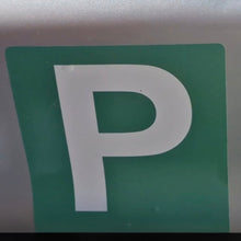 Load image into Gallery viewer, Close-up of a green parking sign with a white 'P'.