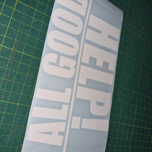 Load image into Gallery viewer, White decal with 'HELP! ALL GOOD' text on a green cutting mat