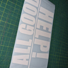Load image into Gallery viewer, White decal with 'HELP! ALL GOOD' text on a green cutting mat