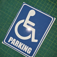Load image into Gallery viewer, Handicap parking sign on a green grid background