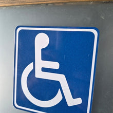 Load image into Gallery viewer, Handicap access sign on a metallic surface