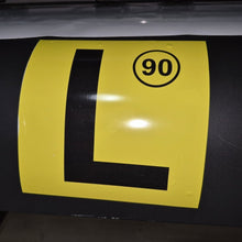 Load image into Gallery viewer, Yellow and black traffic sign with number 90 on a dark surface