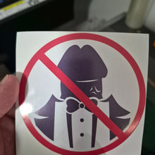 Load image into Gallery viewer, No Dickheads Allowed Prohibition Sticker with a cartoon character wearing a gas mask, held by a hand.