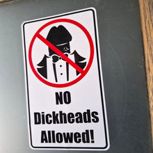 Load image into Gallery viewer, Sticker with a 'No dickheads allowed!' message on a metallic surface.