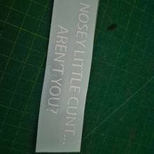 Load image into Gallery viewer, Clear decal with text on a green cutting mat