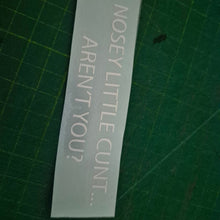 Load image into Gallery viewer, Clear decal with text on a green cutting mat