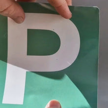 Load image into Gallery viewer, Person holding a green card with a white letter 'P' on a light gray background