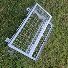 Load image into Gallery viewer, Plumbers cage getting painted on grass