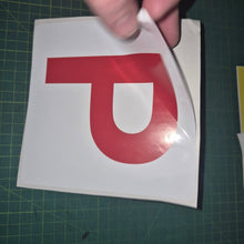 Load image into Gallery viewer, Red 'P' sticker held over a white square on a green cutting mat.