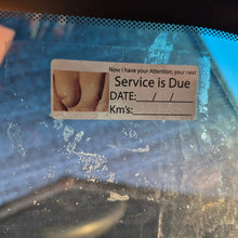 Load image into Gallery viewer, Service due date sticker on a car windshield with a blurred background