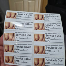 Load image into Gallery viewer, Sheet of car maintenance stickers with 'Service is Due' text held by a hand.