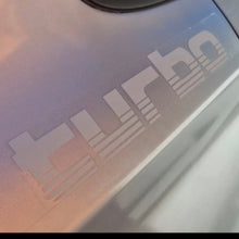 Load image into Gallery viewer, Close-up of a 'Turbo' decal on a vehicle's surface.