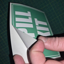 Load image into Gallery viewer, Hand holding a green and white 'Spill Kit' sign on a grid background