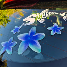 Load image into Gallery viewer, Frangipani Blue flower decals on a car window with a visible brand logo in the background.