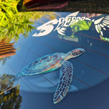 Load image into Gallery viewer, Car window with a turtle and bird decal on a reflective surface